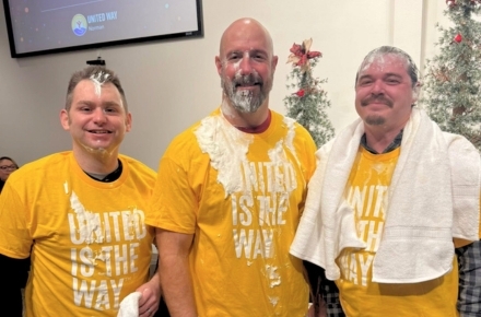 Three messy men after getting pied in the face