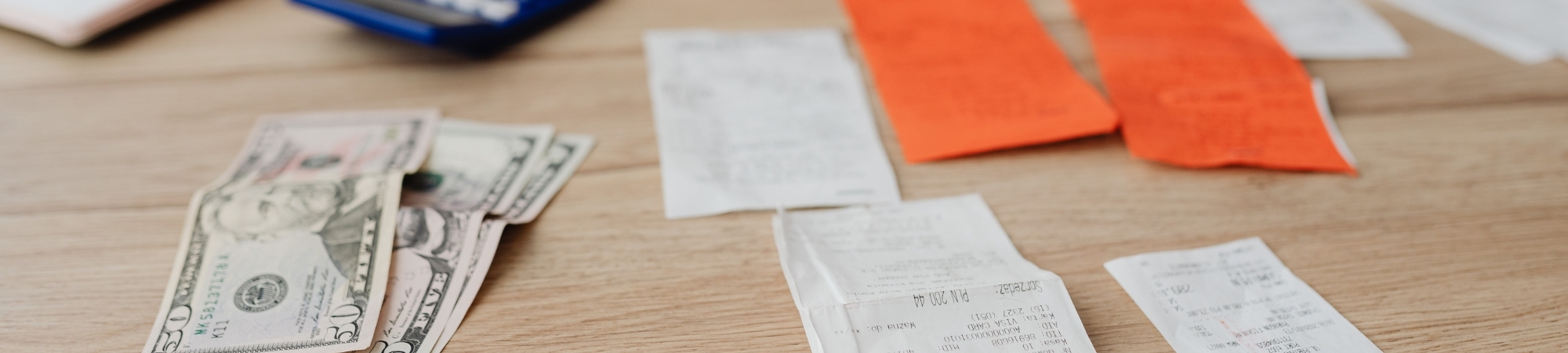 Table filled with receipts and cash